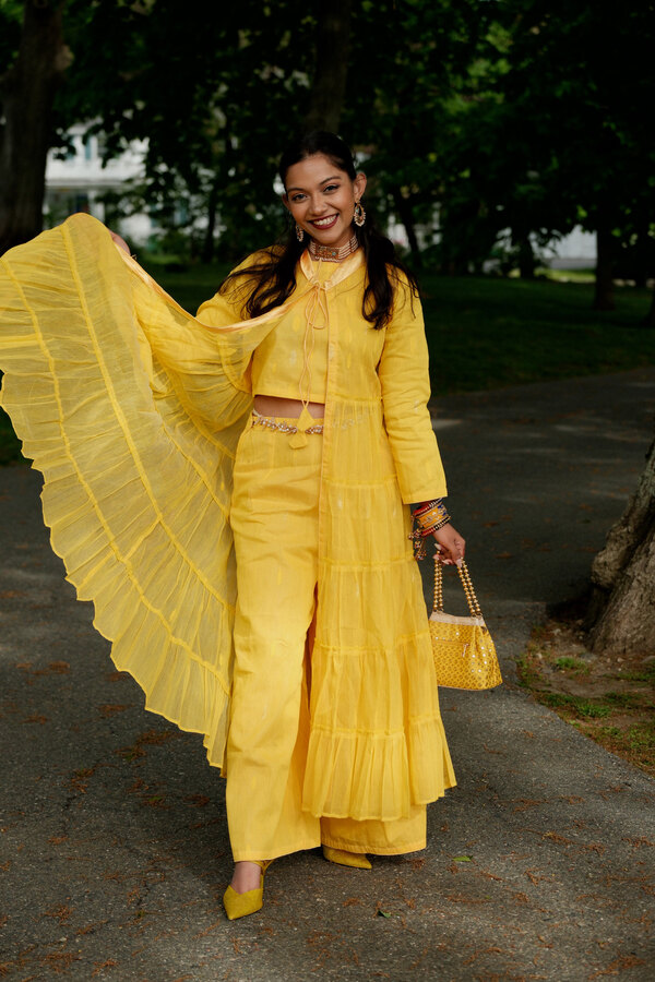 Twirling in a yellow outfit