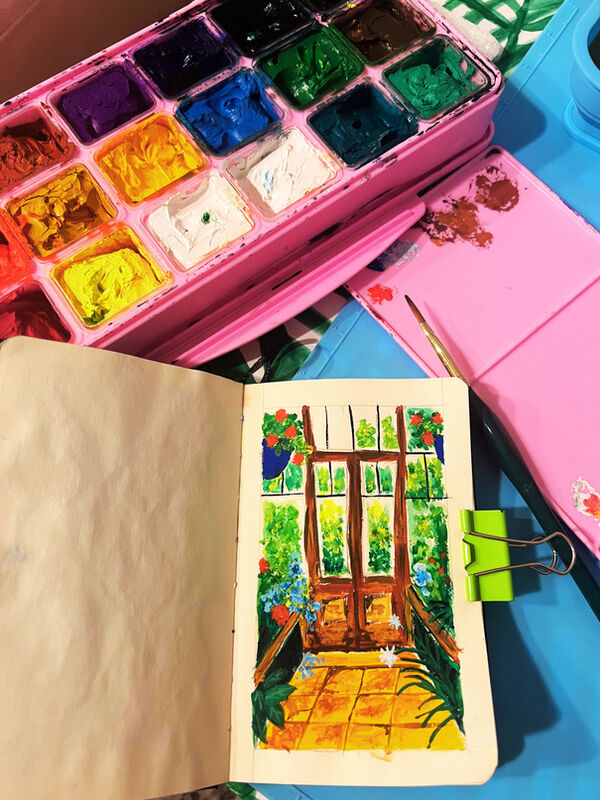 Watercolor palette and sketchbook